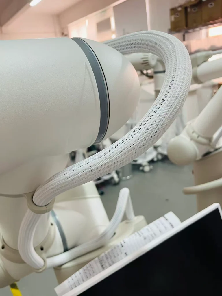 Robotic arm and cable detail of AI smokeless moxibustion robot