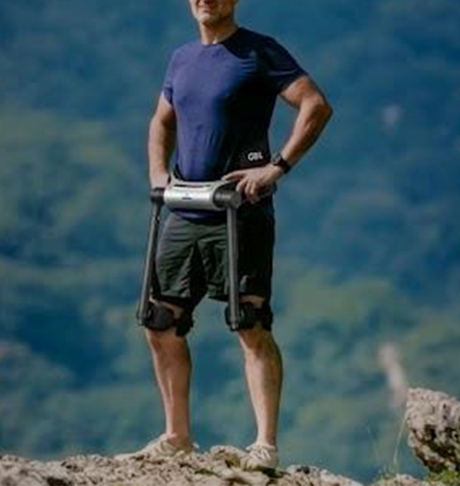 Person wearing an AI walking assist exoskeleton outdoors
